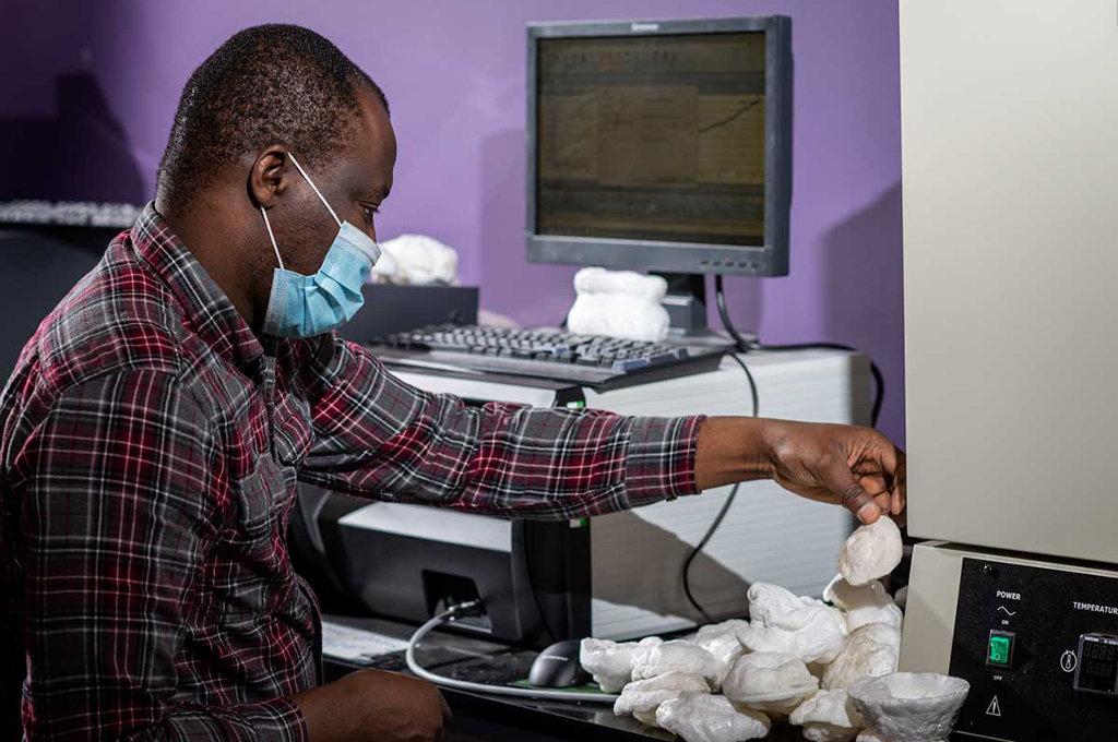 Kayode Oluwabunmi inspects one of the foam prototypes