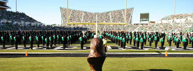 Mean Green band and cheer leaders in the football field