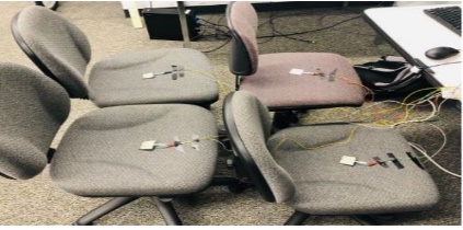 Image showing four chairs with sensors and wires etc.