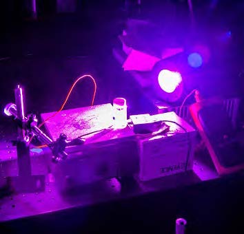 Photo of the testing setup under purple light