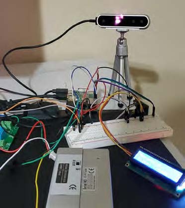 Photo of the system showing camera, display and breadboard connected by wires