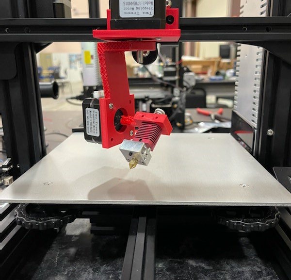 Photo of the extruder head on red arm