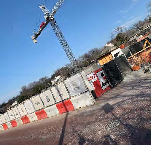 Photo of the construction site with a crane up in the air