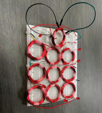 Photo of 10 red coils on a breadboard