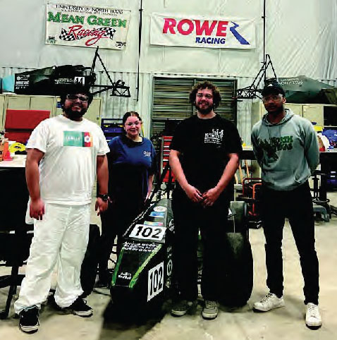 Photo of team members with the racecar