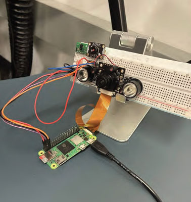 A PCB ciruit connected with components on a breadboard