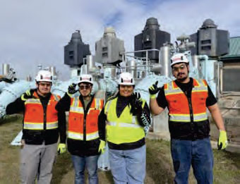 Team members pose in the water treatment plant