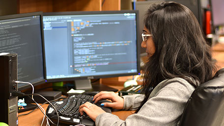 Female graduate student working in lab