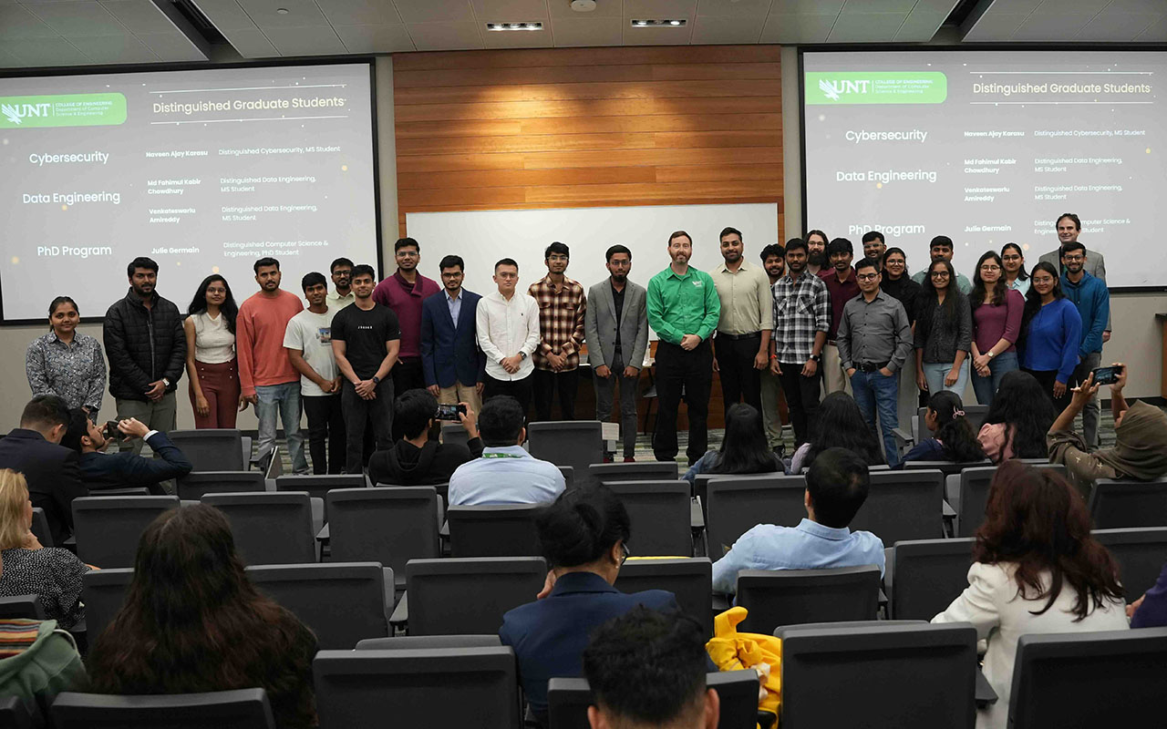 Group photo of students with professor