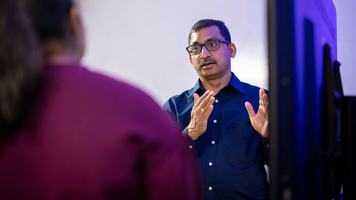 Dr. Namuduri speaking with a student