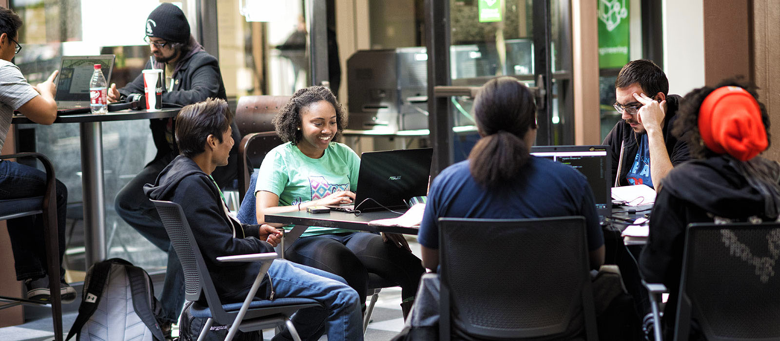 Students on computers laughing
