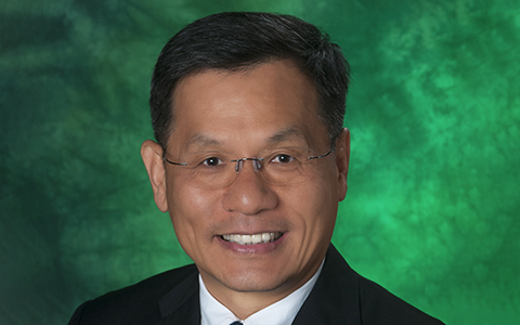 Headshot of Wonbong Choi against a green backdrop