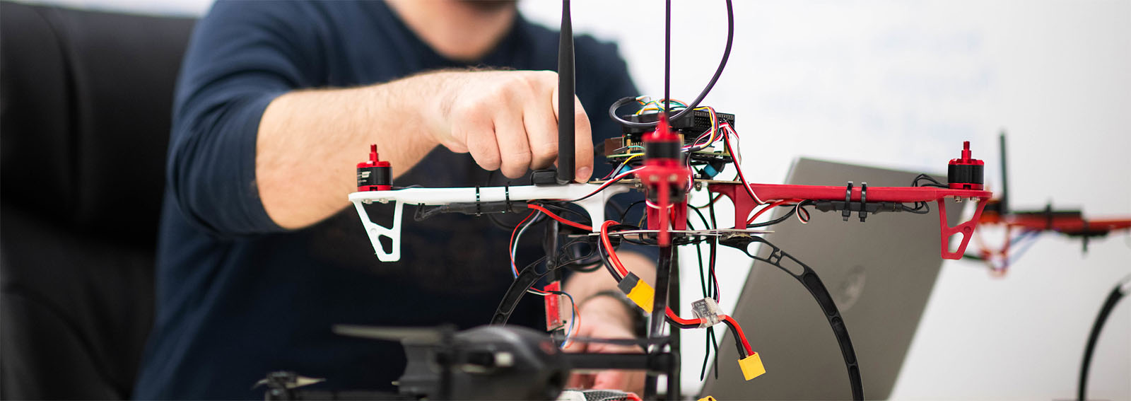 Student working on a drone