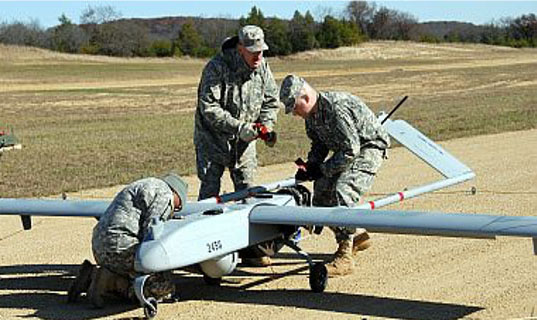 Soldiers working on drone
