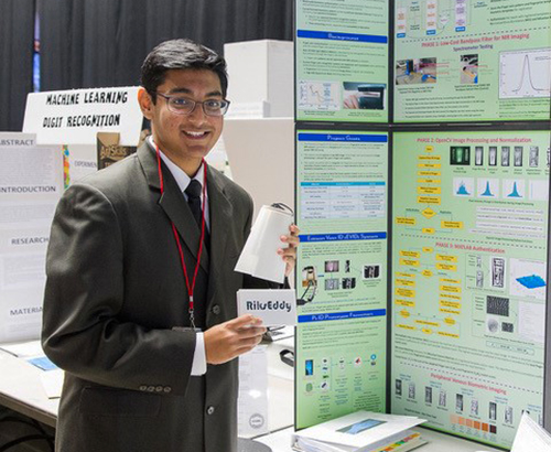 Ritik in front of his poster