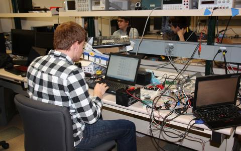 Electrical Engineering senior working in lab