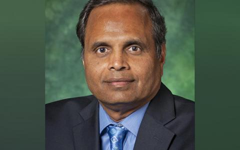 Headshot of Ram Dantu with a UNT green backdrop